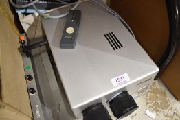 A vintage Rollei slide projector and accessories, untested.