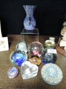 A selection of art glass paper weights including signed Sarah Shaw and Caithness