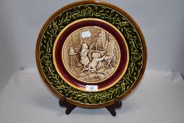 A vintage ceramic plate by Schutz Blansko Austria depicting children playing