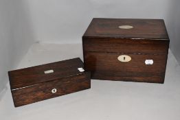 A late Victorian rosewood veneered vanity box having blue velvet lining,glass bottles and
