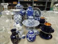 A Chinese blue and white 'cracked ice and prunus' baluster vase, lacking cover and bearing four