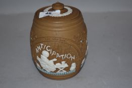 A late 19th/early 20th century silicon ware lidded tobacco jar,having relief design depicting Monk