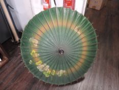A vintage bamboo handled Chinese sun parasol with painted decoration