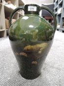 A substantial and impressive arts and crafts era vase decorated with the scene of a chick warning