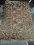 A North West Persian rug, having four central canyed square guls, within multiple borders.