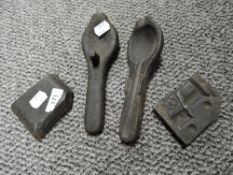 Two cast metal moulds, for a spoon and toy horse and cart.