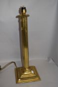 A brass reeded column table lamp, with stepped and moulded square base