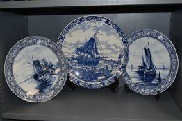 Three Delft chargers circa late 19th century, including Two marked for Royal Bonn,one with