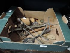 A selection of vintage kitchen wares including biscuit press and butter patts
