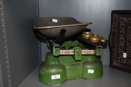 A set of W and T Avery weighing scales with weights.
