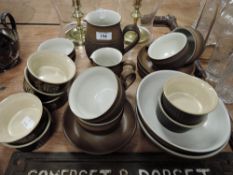 A selection of Denby kitchenwares including teacups and ramakin