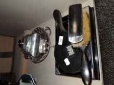 An Edwardian silver mounted ebony dressing table set, to include tray, hand mirror, hair brush and