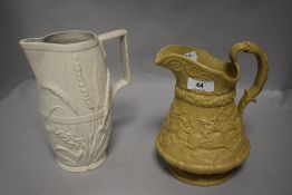 Two 19th century jugs, white Copeland jug having embossed wheat design with Lozenge to base and
