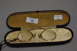 A pair of early 20th century yellow metal Pince nez, marked Varsity