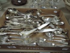 A collection of flatware, including MOP handled knives.