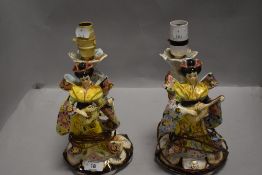 A pair of kitsch mid century lamp bases in the form of two geisha