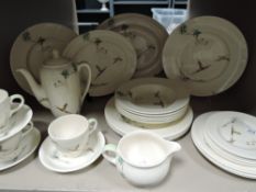 a vintage hunting themed dinner service by Royal Doulton in the Coppice design