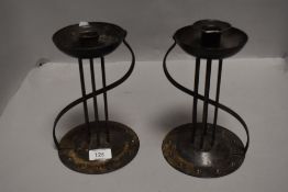 A pair of German Arts & Crafts 'Goberg' (Hugo Berger) iron candlesticks, impressed marks to base