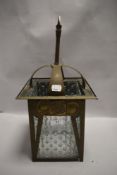 An antique hammered brass and textured glass lamp shade having Rennie Mackintosh styling.