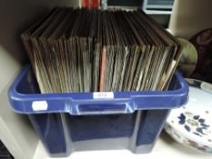 A selection of vinyl records and albums including Mike Oldfield