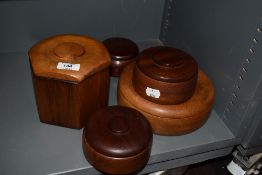 A group of five turned wood storage boxes
