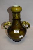 An antique Majolica Sarreguemines vase having gargoyle handles AF converted lamp base