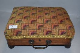 A small early 20th century inlaid mahogany foot stool, the padded tapestry seat with repeating