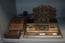An embossed leather clad desk top set,Circa 1930s/40s, comprising of blotter,pad,stamp box,ink wells
