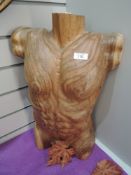 A carved acacia wood male form.