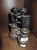 A pair of vintage binoculars a a modern pair of Mark Scheffel