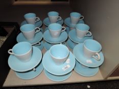 A set of eighteen vintage tea cup and saucer sets by Poole in a two tone blue and grey design