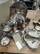 A selection of silver plated table wares including ornate salver and lidded serving trays