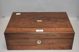 A rosewood veneered mahogany writing slope having MOP escutcheon and lid detail and compartmental