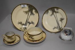 A 19th century tea bowl having floral exterior and two figures with willow to centre sold with a