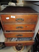 An early 20th century stripped pine small chest of four drawers