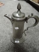 A continental style pewter ewer or decanter with a Dutch style