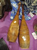 Two antique wooden Jugglers clubs.