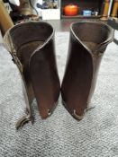 A pair of early to mid 20th century leather gaiters,possibly military.