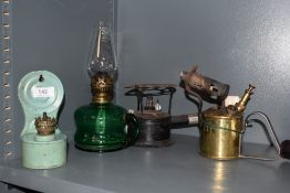 A Swedish Max Sievert brass blow torch, a green enamelled paraffin lamp, green glass paraffin lamp