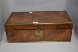 A large Victorian walnut veneered mahogany writing slope having brass edging and plaque to centre,