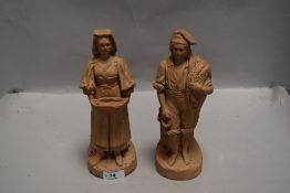A pair of antique Italian terracotta figures of fisherman and similar impressed JH to base circa