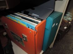 Two vintage record cases with vinyl records including Elton John
