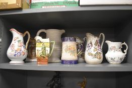 A selection of decorative jugs including Royal Doulton series ware and Scottish Govancroft jug