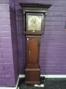 An 18th century oak eight-day long case clock, named Miles Wedred (Kirby Lonsdale), having a moulded