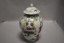A 19th century Chinese Famille Vert pottery lidded vase, of ovoid form, decorated in polychrome with