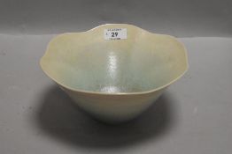 A studio pottery vase by Peter Lane in a lustre glaze with green fade