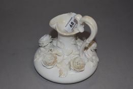 A mid 19th century Derby Blanc de Chine ewer, having rose encrusted body, Stevenson,sharp and Co