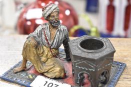 After Franz Bergman, a cast and painted metal inkwell, seated Arab gentleman, unmarked