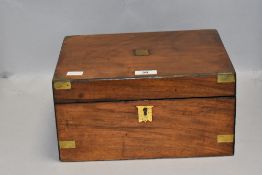 A Victorian figured mahogany writing slope having compartmental interior and lined in pink velvet.