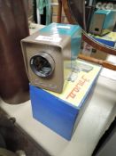 A portable Etude slide projector with case